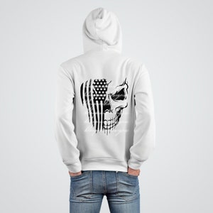 May include: White hooded sweatshirt with a black and white graphic of a skull with an American flag behind it.