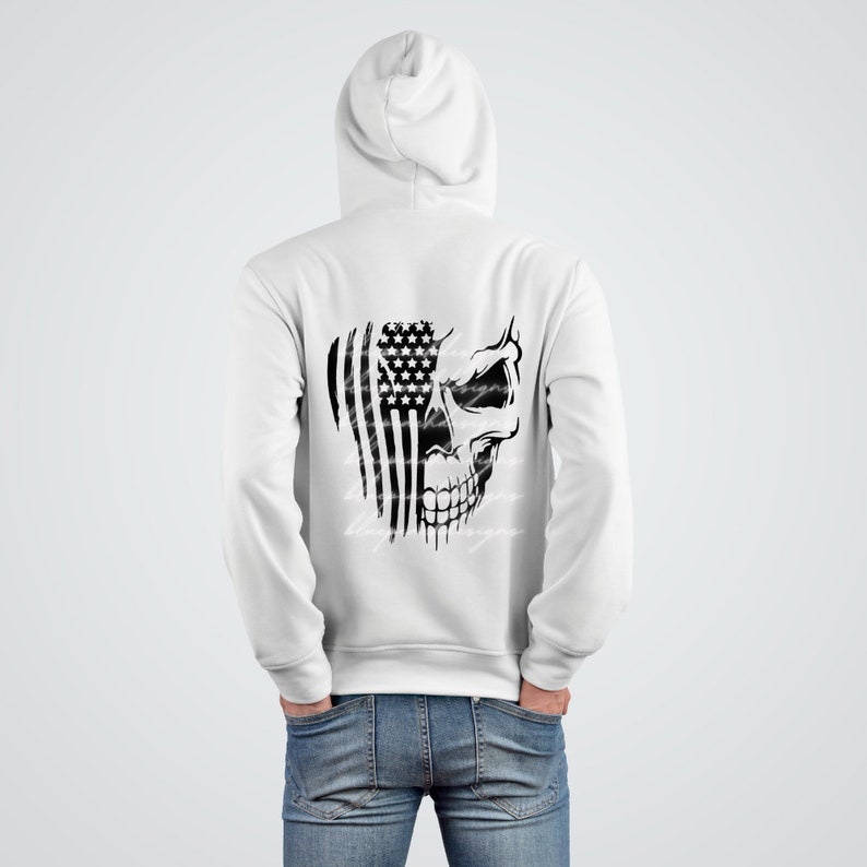 May include: White hooded sweatshirt with a black and white graphic of a skull with an American flag behind it.