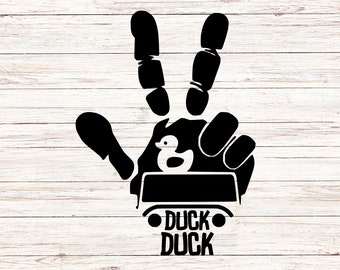 May include: Black silhouette of a hand with two fingers raised in a peace sign, holding a rubber ducky in a small vehicle with the text "Duck Duck" below.