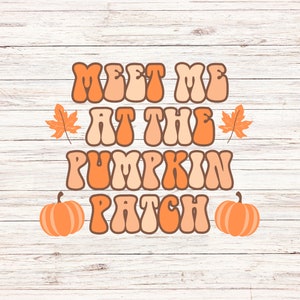 May include: A retro-style graphic with the text "Meet me at the pumpkin patch" in orange and peach colors. The graphic is set against a white woodgrain background and includes two orange pumpkins and two orange leaves.