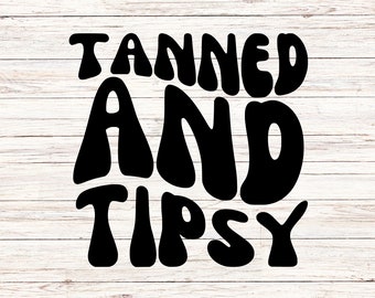 May include: Black and white text graphic on a wood background that reads "Tanned and Tipsy".