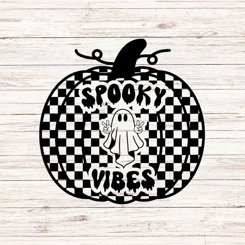 May include: A black and white chequered pumpkin design with the words "Spooky Vibes" and a ghost making a peace sign. The pumpkin has a stem and is set against a white wood background.