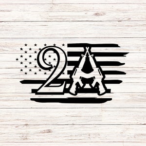 May include: Black and white graphic design featuring the number 2 and the letter A, with two crossed rifles. The design is set against a background of an American flag.