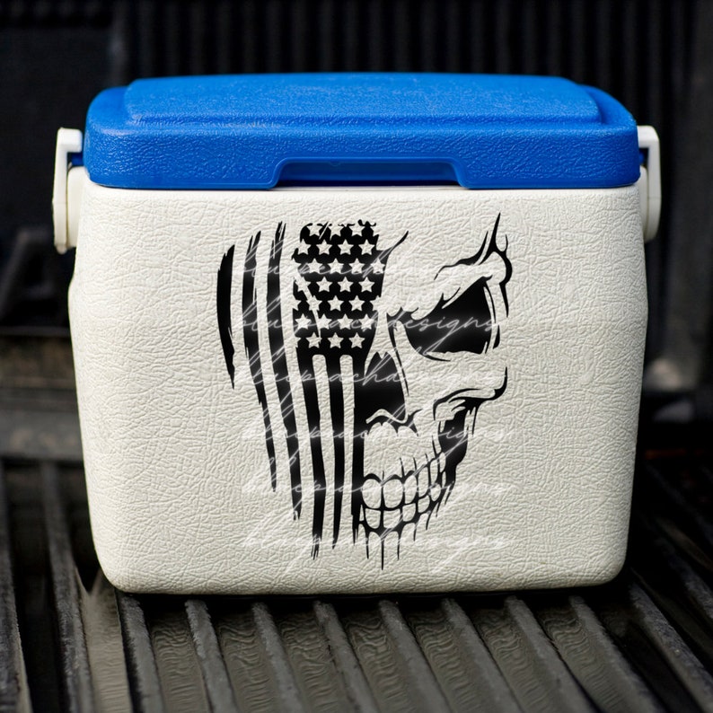 May include: White cooler with a blue lid featuring a black and white skull graphic with an American flag design.