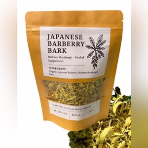 May include: A kraft paper bag with a clear window, filled with shredded yellow bark. The label reads "JAPANESE BARBERRY BARK" and lists ingredients and a warning. Net weight is 2 oz.
