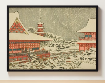 May include: A woodblock print depicting a snowy scene in Japan. The print shows a red temple with a pagoda in the background. The temple is covered in snow and there are people walking around it. The sky is gray and there are snowflakes falling.