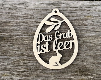 Osterdekoration Das Grab ist leer Ei aus Holz als Ostergeschenk