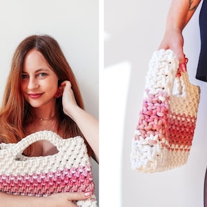 May include: A handmade macrame tote bag in white and pink. The bag features a rectangular shape with a handle and a striped design. The bag is made of thick, woven cotton rope, and the color gradient transitions from white to pink.