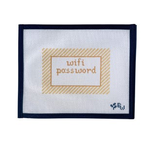 May include: A white canvas with a navy blue border features the words "wifi password" in a gold-colored frame. The canvas has a gold and white striped pattern. A small, stylized floral design is in the lower right corner.