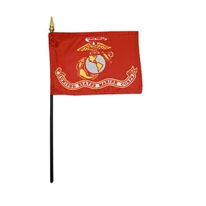 May include: A small, red United States Marine Corps flag with a gold eagle, globe, and anchor emblem. The flag is attached to a black pole with a gold spearhead.