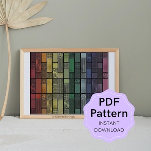 Op de afbeelding: Een ingelijste print van een geometrisch patroon in regenboogkleuren met een witte rand. De print is in een houten lijst en heeft de tekst "@KnitWitFiberCrafts" onderaan. Een paarse cirkel met de tekst "PDF Pattern INSTANT DOWNLOAD" bevindt zich in de rechterbenedenhoek van de afbeelding.