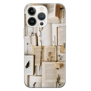 May include: A clear phone case with a design of open books and dried flowers. The books are stacked and the flowers are arranged in a pattern.