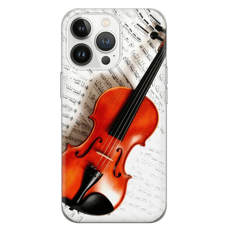 K&ouml;nnte beinhalten: Eine braune Violine mit schwarzen Saiten liegt auf einem Notenblatt. Die Violine ist nach rechts geneigt und das Notenblatt ist wei&szlig; mit schwarzen Noten.