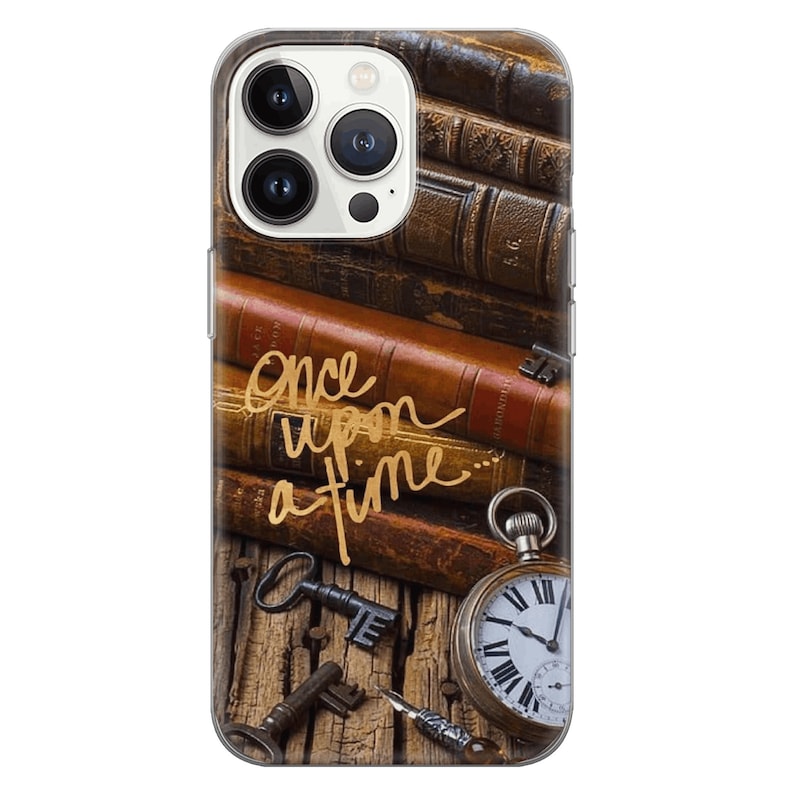May include: A clear phone case with a design of old books, keys, a pocket watch, and a quill pen. The text "Once upon a time..." is written in gold script on the case.