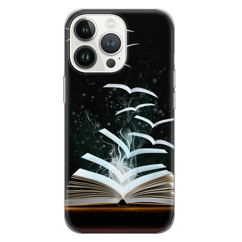 May include: An open book with pages flying out of it like birds. The pages are white and the book is on a dark wooden surface. The background is black with white stars.