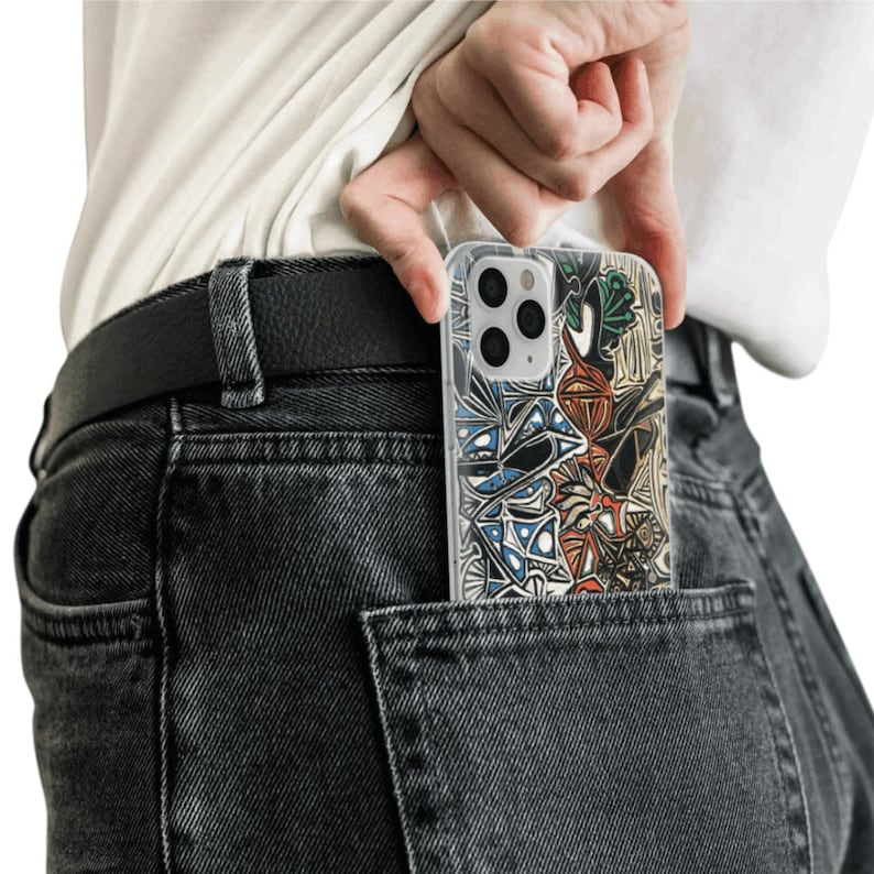 May include: A person wearing jeans with a black belt and a clear phone case with a colorful abstract design in their back pocket.