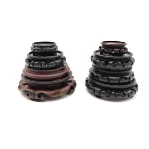 May include: A rustic wooden sign with the text "Welcome to our home" in white lettering. The sign features a distressed finish and a simple, inviting design, perfect for a front porch or entryway.