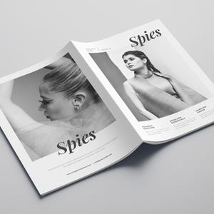 May include: A black and white magazine cover with the word "Spies" in bold, large font. The cover features two women, one on each side of the magazine. The woman on the left is looking down and her face is partially obscured. The woman on the right is looking at the camera and has her hair pulled back. The magazine cover also includes the text "Classic Colors", "Silk Essentials", and "Curated Chaos".