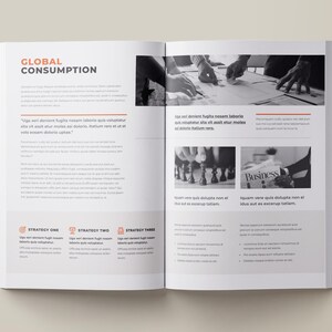 May include: A page from a business report titled "Global Consumption" with text and images. The text discusses strategies for global consumption. The images show hands working on a table, a chessboard, and a newspaper with the word "Business" on it.