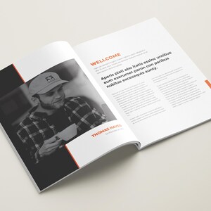 May include: A black and white photo of a person wearing a black and white plaid shirt and a baseball cap with the letters "HH" on it. The person is holding a white mug. The text "WELLCOME" and "THOMAS HAYES" is visible on the page.