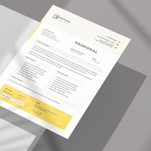May include: A white and yellow proposal document with the word "PROPOSAL" in large text. The document includes company information, project details, and a signature. The document is angled, with shadows.