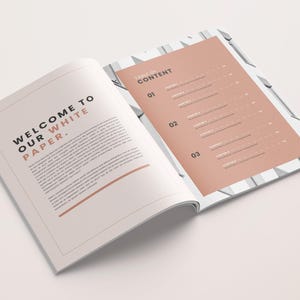 May include: An open white paper booklet with a peach-colored page showing a table of contents with the heading "Table of Content". The left page has the text "Welcome to our white paper."