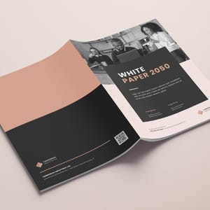 May include: A white paper with the title "White Paper 2050" and a black and white photo of three people in a cafe. The paper is folded in half and the back cover has a black and white logo with the text "Tomorrow Industries Ltd."