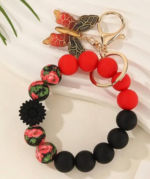 Handmade Beaded Wristlet Keychain with black and gold butterfly.