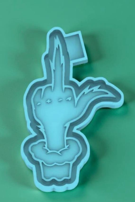 One fury green finger car freshie mold or mold housing.