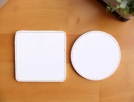 sublimation coasters in holder.