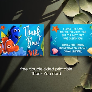 May include: A blue and orange thank you card featuring characters from the movie Finding Nemo. The front of the card says "Thank You!" and the back says "I loved the cake and the presents too but the best part was seeing you! Thanks for making my birthday so special! XOXO Jennifer".