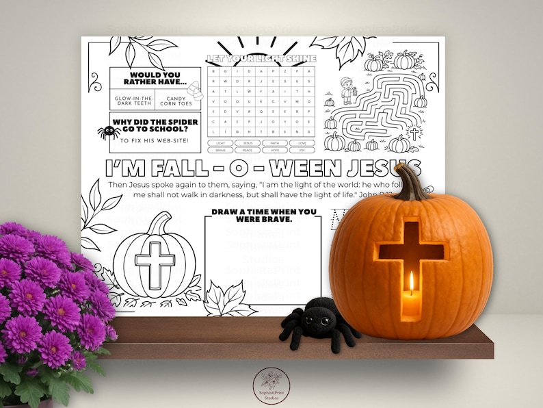 Printable Fall-o-Ween Jesus themed coloring placemat featuring pumpkins, fall leaves, crosses, and Bible verse elements with "Jesus is the Light" and Bo Fear, God is Near message, designed as a kids Christian Halloween alternative activity worksheet.