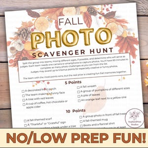 May include: A printable Fall Photo Scavenger Hunt game with a decorative border of fall leaves, pinecones, and orange slices. The gold text reads "FALL PHOTO SCAVENGER HUNT" with a list of photo challenges. The bottom reads "NO/LOW PREP FUN!"