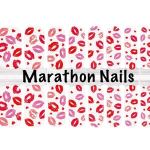 May include: White nail wraps with a pattern of red and pink lips and small hearts. The words "Marathon Nails" are printed in black across the center of the wraps. The nail wraps are designed for easy application.