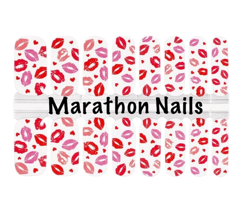 May include: White nail wraps with a pattern of red and pink lips and small hearts. The words "Marathon Nails" are printed in black across the center of the wraps. The nail wraps are designed for easy application.