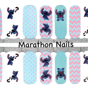 May include: Nail wraps featuring a blue cartoon character with a question mark above its head, a blue cartoon character with its tongue sticking out, and a blue cartoon character with its arms raised. The wraps also feature a pink and blue chevron pattern and a blue and pink polka dot pattern. The text "Marathon Nails" is printed on the image.