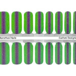 May include: Set of 20 green and purple nail wraps with a glitter finish. The nail wraps are designed to be applied to fingernails. Marathon Nails Custom Designs.