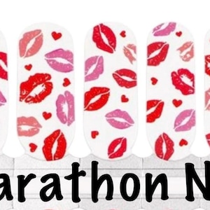 May include: White nail wraps with a pattern of red and pink lips and small red hearts. The words "Marathon Nails" are printed in black at the bottom of the image. These nail wraps are designed for easy application.
