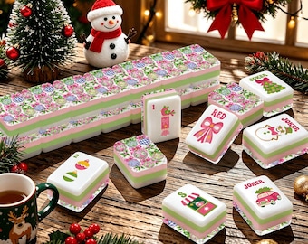 May include: A set of Mahjong tiles featuring Christmas-themed illustrations including ornaments, a snowman, a red bow, and a car with a tree. The tiles have a white top surface with colorful graphics and a light green base, arranged on a wooden surface.