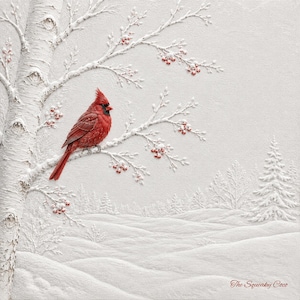 May include: A textured white wall art piece featuring a bright red cardinal perched on a snow-covered birch tree branch with small red berries. The scene depicts a winter landscape with snowy hills and pine trees, signed The Squeaky Coco.