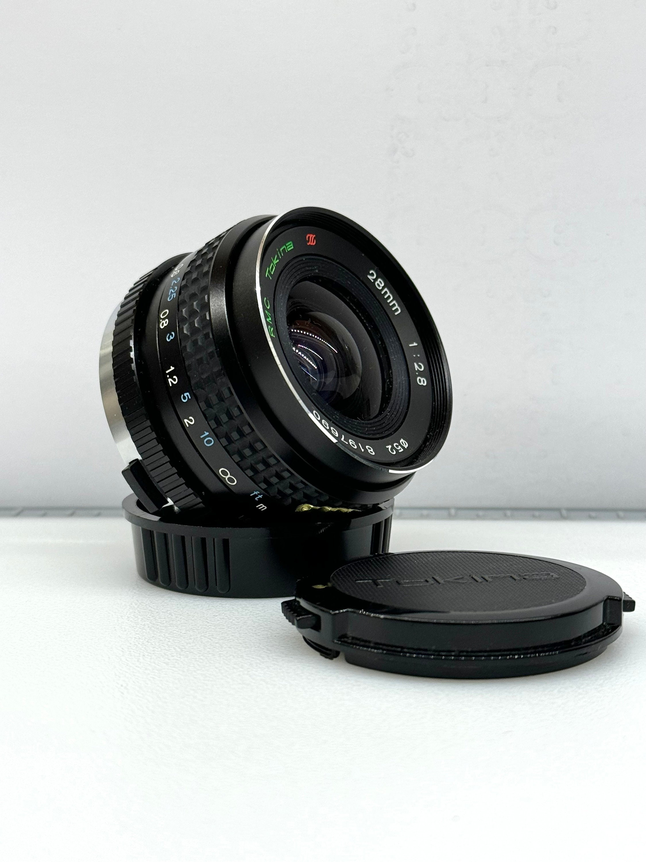 RMC TOKINA 28mm 1:2.8 Pour Olympus RMC TOKINA 28mm 1:2.8 Pour Olympus