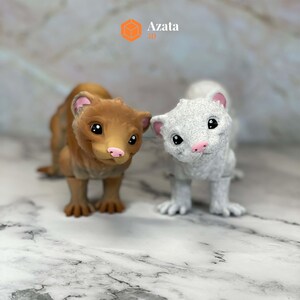 a couple of small animals standing next to each other