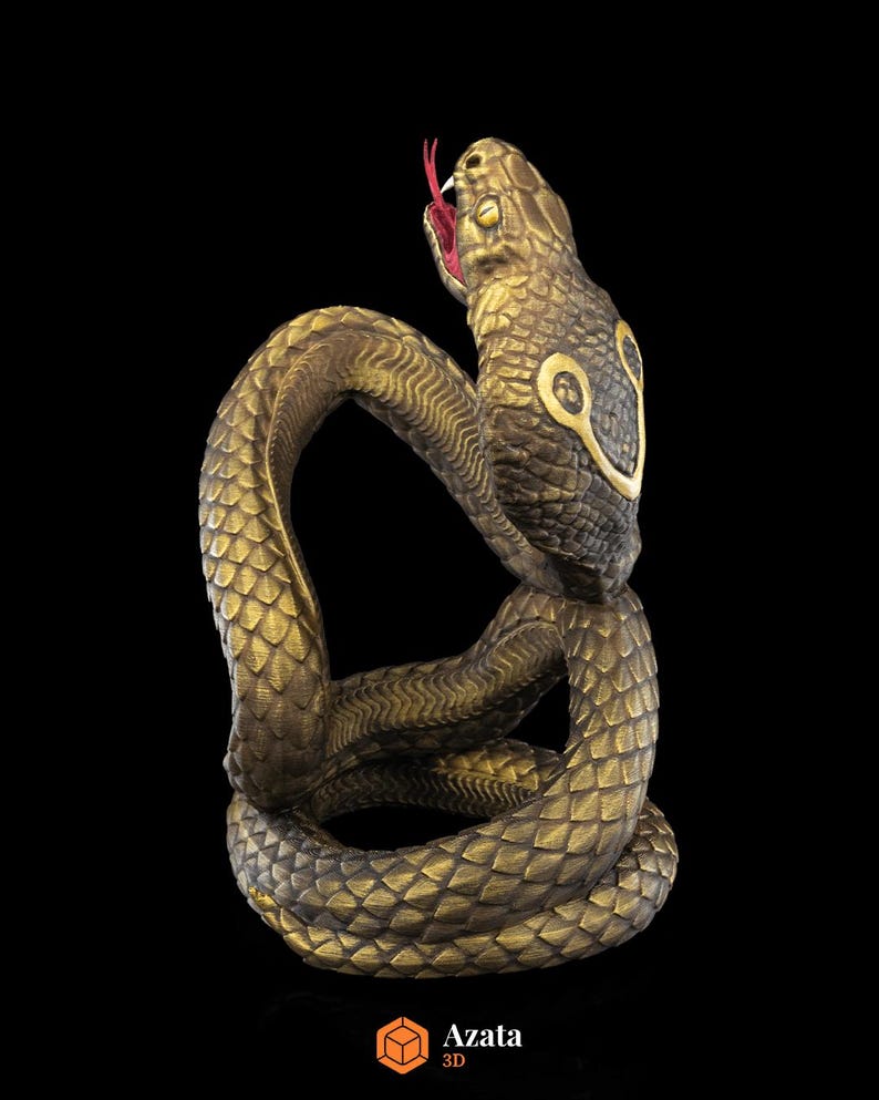 a statue of a snake on a black background