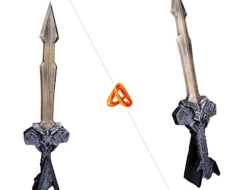 May include: A decorative sword stand with a black and silver finish. The sword has a gold-colored blade and a detailed handle.