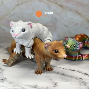 a couple of toy animals sitting on top of a table