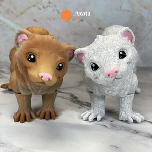 a couple of toy animals sitting on top of a table