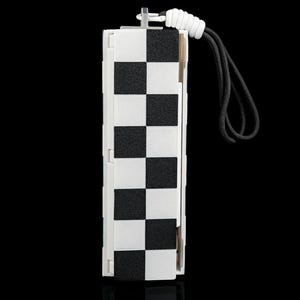 May include: A rectangular, white and black checkered pattern device with a black lanyard. The device has a white frame and a series of alternating black and white squares. A white cord is attached to the top, leading to a black lanyard.
