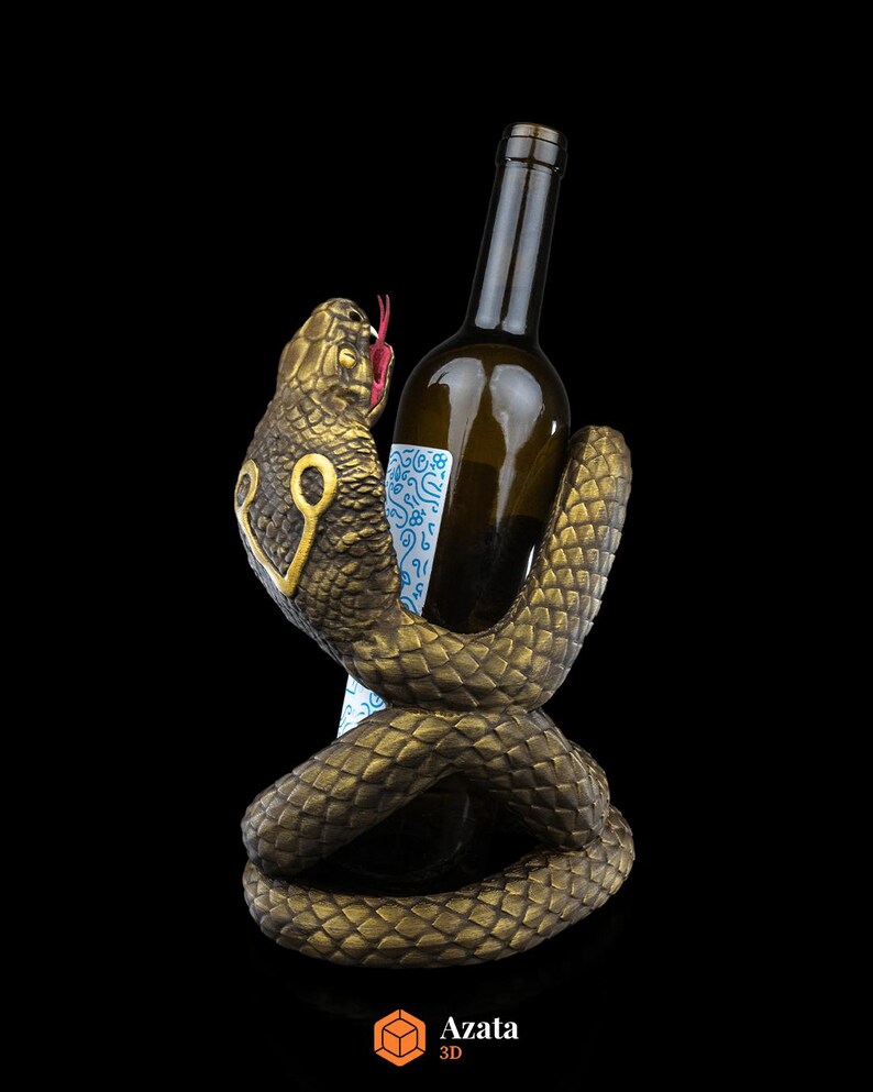 a snake holding a bottle of wine in it's mouth