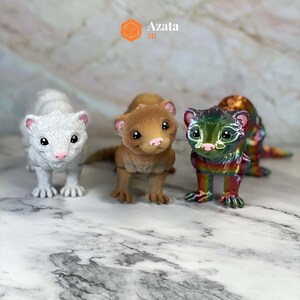a group of small toy animals on a marble surface