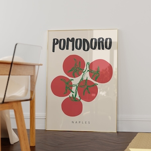 May include: A framed poster with a minimalist design featuring a red tomato vine with the word "POMODORO" in black text and the word "NAPLES" in black text at the bottom.